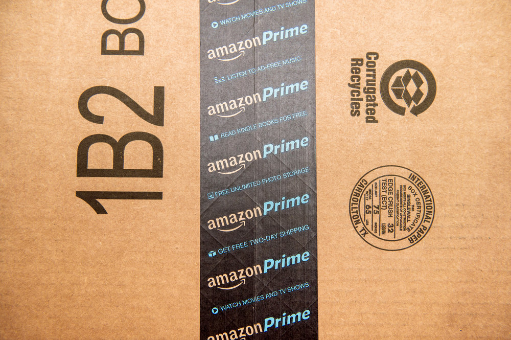 Amazon Prime logotype printed on cardboard box security scotch